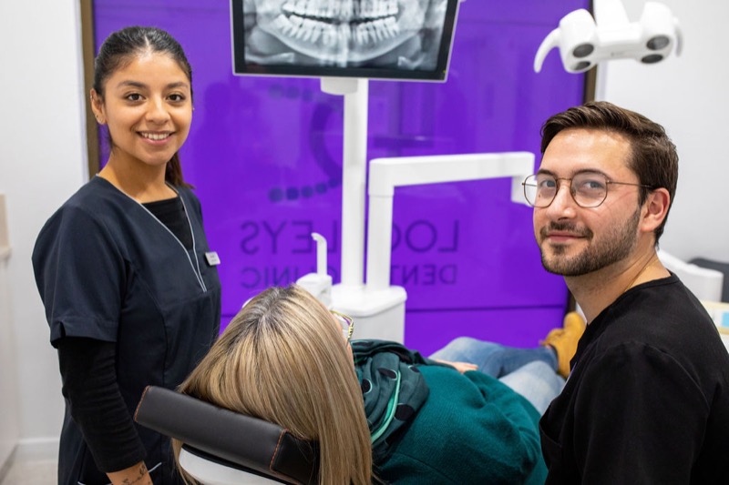 Dr Alex Furlan and team performing dental implant procedure